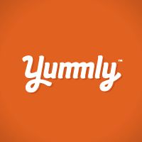 the word yummy is written in white on an orange checkerboard pattern background