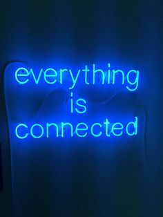 a neon sign that says everything is connected