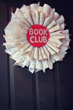 a book club wreath hanging on the door