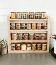 a shelf filled with lots of different types of spices