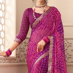 Purple colored saree is made from chiffon fabric which is highlighted with beautiful bandhani printed work as shown. Comes along unstitched blouse piece which you can customise as per your design/style. Occasion - You can wear this saree for casual, outings, social meets and other homely events. Style it up - Look glamorous in this traditional Pair this saree with Ethnic Gold Jewellery, beautiful clutch to complete the look!! Note:- the actual product may differ slightly in color and design from the one illustrated in the images when compared with computer or mobile screen. Measurements: Saree : Chiffon : 5.5 Mtrs Blouse : Chiffon : 0.8 Mtr Material: Chiffon Stitch Type: Unstitched Country of Origin: India Care Guide: Dry Clean Bandhani Blouse Pattern, Bandhani Saree Blouse Design, Bandhani Blouse, Printed Chiffon Saree, Blouse Chiffon, Saree Chiffon, Blouse Designs Catalogue, Saree Blouse Design, Saree And Blouse