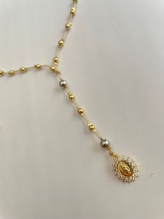 Step into the unknown with our Gold Beaded Rosary. This handmade rosary features stunning gold plated beads for a unique look that's sure to turn heads. Discover courage and strength with every bead and embark on a journey of faith and exploration with the Gold Beaded Rosary!