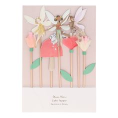 four toothpicks with flowers and tinker fairy on them, one is pink