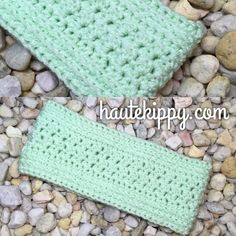 two crocheted headbands laying on top of rocks and gravel with the words, free crochet pattern