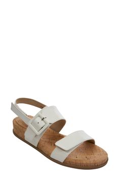 A cork-textured footbed adds a touch of earthy style to this essential everyday sandal. 1 1/4" heel Adjustable straps with hook-and-loop closure Cushioned footbed with arch support Leather upper/synthetic lining/rubber sole Imported Cork Wedge Sandals With Buckle Closure, White Cork Open Toe Sandals, White Cork Sandals For Summer, White Cork Sandals For Spring, Cork Open Toe Sandals With Heel Strap, Cork Open Toe Wedge Sandals With Textured Footbed, Summer Cork Footbed Sandals With Removable Insole, Spring Cork Sandals With Buckle Closure, White Cork Sandals With Round Toe