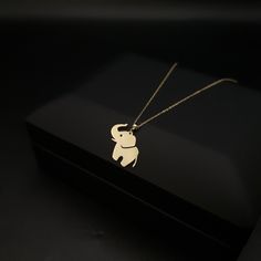 14K Real Gold Baby Elephant Necklace weight: 1.00 gr approximate length: 45.5cm - 18inch PRODUCT CARE * Remove your jewelry before exercising, showering and sleeping. * Avoid exposure to perfumes, lotions and other chemicals. BEST PRICE ON ETSY FOR SOLID 18kGOLD NECKLACES! Premium spring lobster Hook for added safety! Priced to sell! Compare our prices to other similar sellers! Arrives in a GIFT BOX and includes FREE SHIPPING within the USA and Canada. International shipping is available at the most economical rates on ETSY. I HAVE BEEN IN THE JEWELRY BUSINESS ALL MY LIFE. I am a second -generation family member making gold and jewelry. Please feel free to ask me any questions - Always happy to help! We are Shipping with the Best WORLD WIDE SHIPPING COMPANY DHL With INSURANCE Fast Replies Pendant Necklace With Lobster Clasp For Birthday Gift, Pendant Necklace For Birthday Gift, Yellow Gold Necklaces With Charms For Birthday Gift, Handmade Yellow Gold Necklace For Personalized Gift, Handmade Yellow Gold Necklaces For Birthdays, White Gold Pendant Necklace For Birthday Gift, Crismas Gift, Mothers Birthday Gift, Mothers Birthday