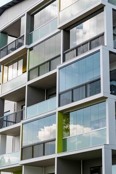 an apartment building with multiple balconies and windows