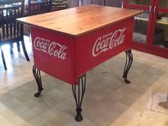 an old coca cola cooler turned into a dining room table