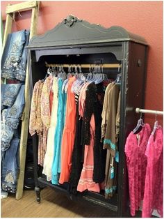 an old fashion clothing rack with clothes hanging on it