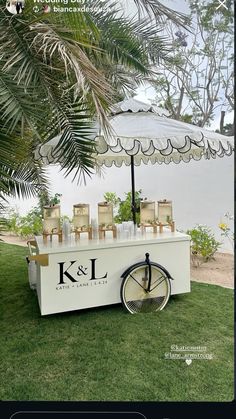 an ice cream cart is set up in the grass