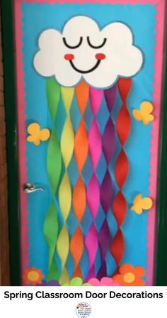 a classroom door decorated with colorful paper streamers and a smiling cloud on the top