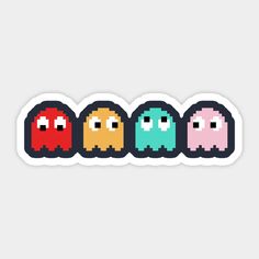 four pacman stickers in different colors and sizes, all with eyes on them