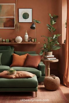 a living room with orange walls and green couch, potted plants on the table