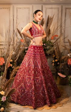 Farah features a maroon lehenga with multicolored resham embroidery, paired with a complementing blouse and net dupatta.by Chamee and Palak. DELIVERY TIMEPlease allow 4-6 months for your outfit to arrive. FABRIC DETAILSOrganza, Net. Red Chanderi Lehenga With Intricate Embroidery, Red Chinon Lehenga With Resham Embroidery, Red Lehenga With Resham Embroidery In Chinon, Red Chanderi Gown For Navratri, Multicolor Georgette Gown With Resham Embroidery, Reception Lehenga With Multicolor Embroidery In Georgette, Multicolor Georgette Gown With Zari Work, Red Lehenga With Dupatta In Chinon, Red Raw Silk Gown For Navratri