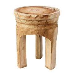 a small wooden stool sitting on top of a white floor