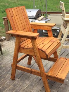 a wooden chair sitting on top of a wooden deck