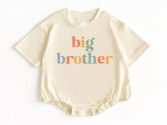 Big Brother T Shirt Bubble Romper, Baby Bodysuit, Big Brother Tee, Big Brother To Be, Pregnancy Announcement, Baby Boy Outfit, Bubble Romper 💗  Welcome to The WildflowerbyMiley Etsy Shop!  This listing is for the bodysuit, sweatshirt or t-shirt only. All other items that are shown in our photos such as shoes, hats, beanies, blankets etc. are for photo staging purposes and are NOT INCLUDED in the sale. DESCRIPTION:  This baby and children's unisex essential fits like a well-loved favorite. Super soft t-shirts, sweatshirts and baby bodysuits for your little lads and gals meant to showcase their big personalities. Its Excellent quality and vibrant print makes one fall in love with it over and over again.  This adorable piece is the perfect lightweight layer for casual wearing.  This product Unisex Short Sleeve Onesie For First Birthday, Summer Onesie With Letter Print For Gender Reveal, Family Matching Short Sleeve Bodysuit For First Birthday, First Birthday Short Sleeve Onesie, Short Sleeve Letter Print Bodysuit For Gender Reveal, White Summer Bodysuit For Gender Reveal, White Bodysuit For Summer Gender Reveal, Cream Short Sleeve Cotton Onesie, Cream Cotton Short Sleeve Onesie