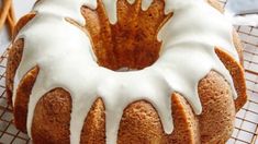 a bundt cake with white icing on a cooling rack