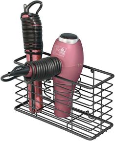 a pink hair dryer sitting on top of a metal basket