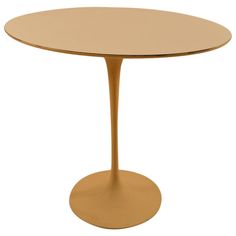 a round table with an oval base and gold colored metal top, on a white background