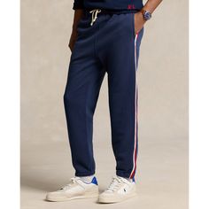 Part of the Polo Ralph Lauren Team USA Collection these classic cotton-blend sweatpants feature braided stripes and a label with the official logo of the U.S. Olympic Team. Striped Sporty Sweatpants For Loungewear, Sporty Striped Sweatpants For Loungewear, Casual Streetwear Bottoms With Signature Stripes, Casual Bottoms With Signature Stripes For Streetwear, Cotton Sweatpants With Side Stripes For Jogging, Casual Three Stripes Joggers For Loungewear, Sporty Cotton Pants With Three Stripes, Cotton Sweatpants With Three Stripes For Jogging, Casual Joggers With Three Stripes Branding For Loungewear