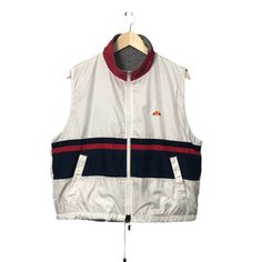 CONDITION - Pre-owned. Original Item - Used condition (scale 8.5/10) - No hole, no rip and no stain  - Zip have defect but in good condition  - Refer picture TAG AND MATERIALS - Label : Ellesse  - Size on tag : Mc(From Measurement it fit to size L) - Made : - MEASUREMENTS - Armpit to armpit : 23 inches - Back collar to bottom : 24 inches PAYMENT - Accept PAYPAL only - No Refund / No Return SHIPPING - This item will be ship along with Tracking Number after received a completed payment. - Please l Sleeveless Zipper Vest For Streetwear, White Sleeveless Outdoor Outerwear, Collegiate Breathable Sleeveless Jersey, White Sleeveless Outdoor Vest, Technical Sports Vest Sleeveless, Breathable Team-colored Sleeveless Jersey, Team-colored Sleeveless Sports Jersey, Mens Formal Vest, Ellesse Jacket