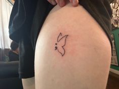 a person with a small tattoo on their thigh and the word bunny written in black ink