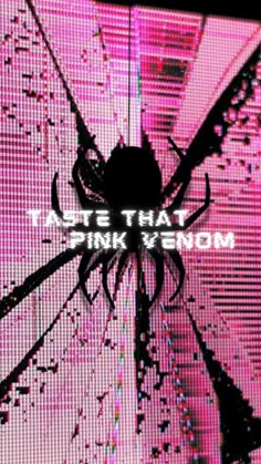 a large spider sitting on top of a pink screen with the words taste that pink neon