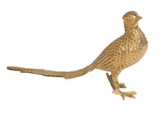 a gold colored bird figurine on a white background