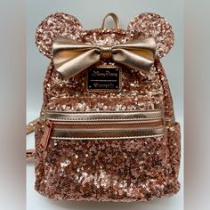 Disney Parks Rose Gold Sequin Minnie Backpack Pre Loved Very Good Condition, Please See Photos And Ask Any Questions You May Have Stored In A Smoke Free Home Early Original Loungefly Backpack With Heart On Logo Makes This A Very Special Backpack For Any Collection! Disney Gingerbread House, Rose Gold Backpack, Mandalorian Tattoo, Disney Anniversary, Red Portrait, Loungefly Hello Kitty, Minnie Mouse Backpack, Loungefly Backpack, Sequin Backpack