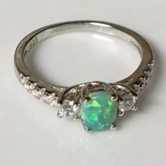 Sterling Silver 925 Stamped Green Lab Opal Ring With Cz Size 7 & 8 Available Elegant Silver Opal Ring With Cubic Zirconia, Silver Opal Ring With Cubic Zirconia Center Stone, Silver Opal Ring With Accent Stones, Round Cut, Classic Silver Opal Ring With Accent Stones, Classic Silver Opal Ring With Diamond, Green Opal, Ring Color, Opal Ring, Opal Rings