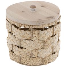 a round wooden box with rope on the top and bottom, sitting on a white background