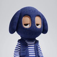 a blue stuffed animal wearing a striped shirt and vest with eyes wide open, standing in front of a white background