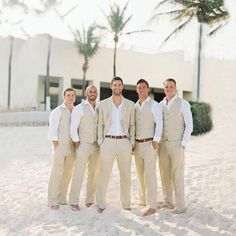 a group of men standing next to each other in the snow