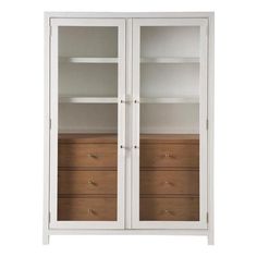 a white bookcase with two doors and drawers on the bottom, in front of a white background