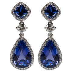 Gorgeous Tanzanite and Diamond Dangling Earrings in 18k Two Pear-Shape Tanzanites weighing 16.00 carats [bright with no imperfections visible to the naked eye] Two Cushion Cut Tanzanites Weighing 4.00 Carats Approximately [bright with no imperfections visible to the naked eye] Two Round Brilliant Cut Diamonds Weighing 1.00 Carats Approximately [GH SI2] Appoximately 104 Round Brilliant Cut Diamonds Weighing 1.50Carats Approximately [GH VVS-VS] Formal Tanzanite Teardrop Earrings, Diamond Dangling Earrings, Round Diamond Setting, Dangler Earrings, Tanzanite Diamond, Diamond Dangle Earrings, Royal Jewels, Dangling Earrings, Green Tourmaline