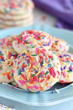 sprinkle covered cookies on a blue plate