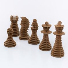 a group of wooden chess pieces sitting on top of each other