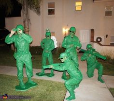 some people are dressed up in green costumes