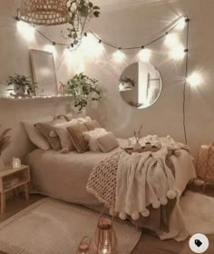 a bedroom decorated with lights and plants in the corner, including an oval mirror on the wall