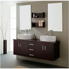 two white sinks sitting next to each other on top of a wooden cabinet in a bathroom