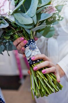 a woman is holding a bouquet of flowers