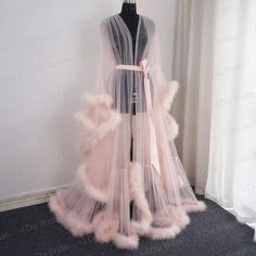 This Is An Elegant, Sexy And Luxurious Sheer Robe With A Feather/Fur Trim And A Gorgeous Satin Tie. This Sheer Gorgeous Gown/Robe Is Perfect For Boudoir And Romantic Moments. You Can Use This Sheer Feather Peignoir With Beautiful Marabou Boas For You Wedding Day, Dancing, Photoshoot Or Romantic Evenings. High Quality Tulle And Marabou Feathers With A Satin Ribbon At The Waist. Perfect For Use As Lingerie Or As A Bridal Robe. Color: Light Pink Size: S/M Runs Large ... This Was Custom Fit For A 5' Feather Bridal Robe, Polka Dot Wedding Dress, Unique Boho Wedding Dress, Pijama Satin, Fancy Robes, Bridal Nightwear, Bridal Fur, Wedding Scarf, Sheer Robe