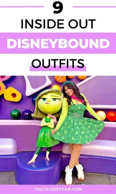 a woman in green dress standing next to a purple wall with the words 9 inside out disneyland