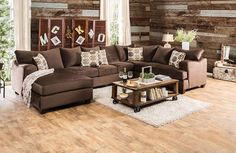 a living room filled with brown furniture and wooden wall paneling on the side of it