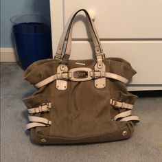 Barely Used Grey Michael Kors Purse With White Accents. In Absolutely Excellent Condition, Literally Looks Brand New, No Signs Of Wear At All. Can Give The Matching White Wallet With Your Purchase But The Wallet Itself Has Lots Of Use Out Of It With A Few Stains And Pen Marks But You Are Welcome To Have It. Everyday Use Canvas Bag With Silver-tone Hardware, Beige Canvas Shoulder Bag With Branded Hardware, White Wallet, White Accents, Coach Swagger Bag, Purses Michael Kors, Michael Kors Bag, Grey And White, Top Handle Bag