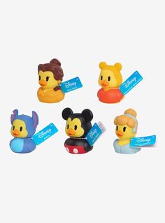 four rubber toy ducks with disney characters on them