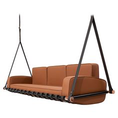 a brown couch hanging from a black metal frame