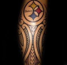 a tattoo on the leg of a man with a pittsburgh football team symbol in it