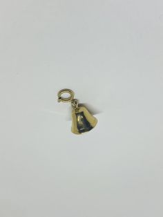 "This is a 14K yellow gold 3D ringing bell pendant/charm. The tongue of the bell, or the part inside that swings to make the bell ring, is called the clapper. The clapper moves, but it does not make much of a sound. Bell symbolism: Throughout society and culture all around the world, a bell has a multitude of symbolic meanings and purposes. Bells can symbolize beginnings and endings, a call to order, or even a command or a warning. Material(s): 14K yellow gold Total weight: 2.4 grams Flaws (if a Vintage 14k Gold Pendant Charms, Antique Yellow Gold Brass Charms, Vintage Yellow Gold Charms Stamped 14k, Vintage 14k Gold Engraved Charms, Vintage 14k Stamped Yellow Gold Charms, Vintage Engraved 14k Gold Charms, Vintage 14k Gold Charms, Vintage Engraved Brass Charms, Gold Bell Jewelry As A Gift